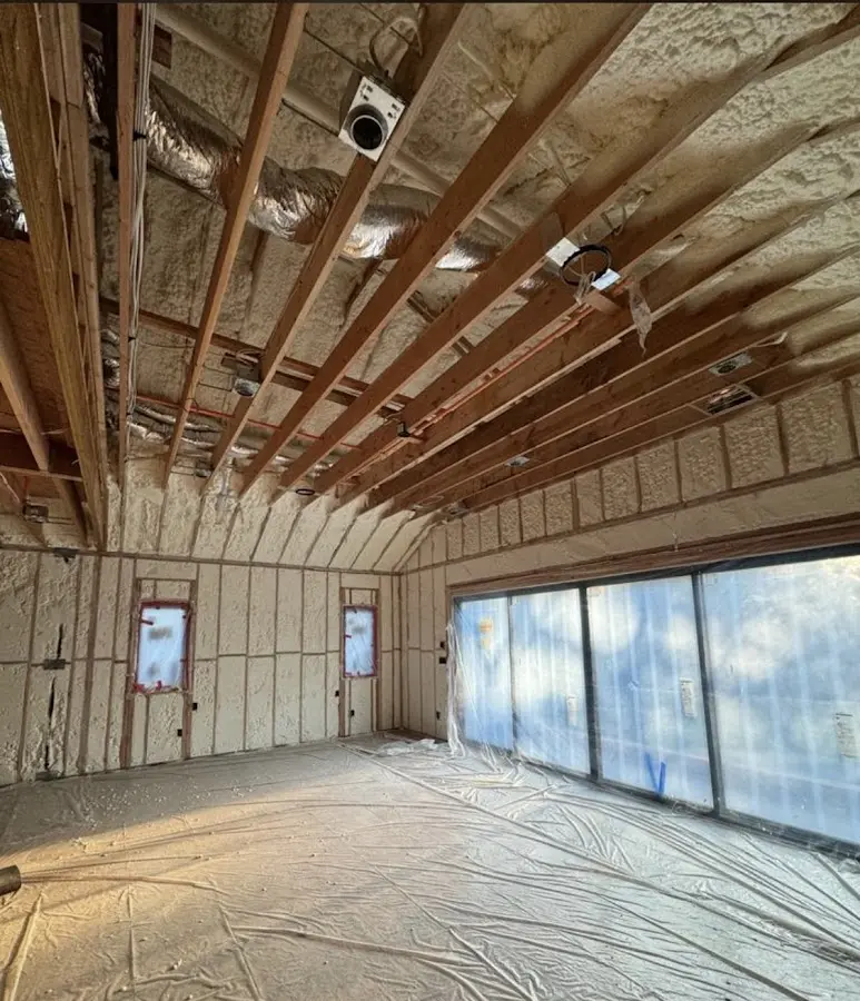 Interior walls and ceiling insulated with spray foam during new construction in Savoy